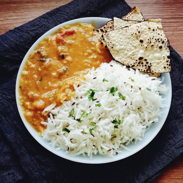 Plate with rice, dal and papad