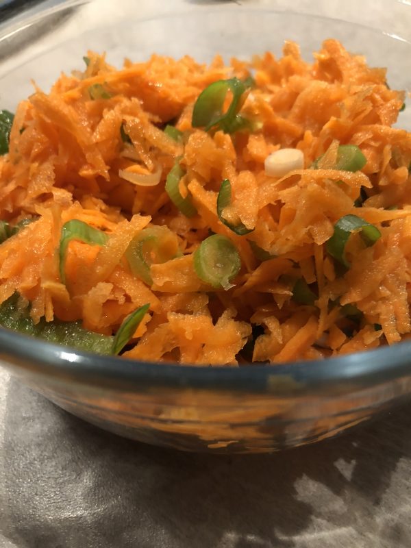 Grated carrot salad with green onions
