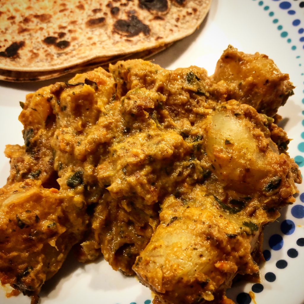 New Potatoes in a curry served with rotis