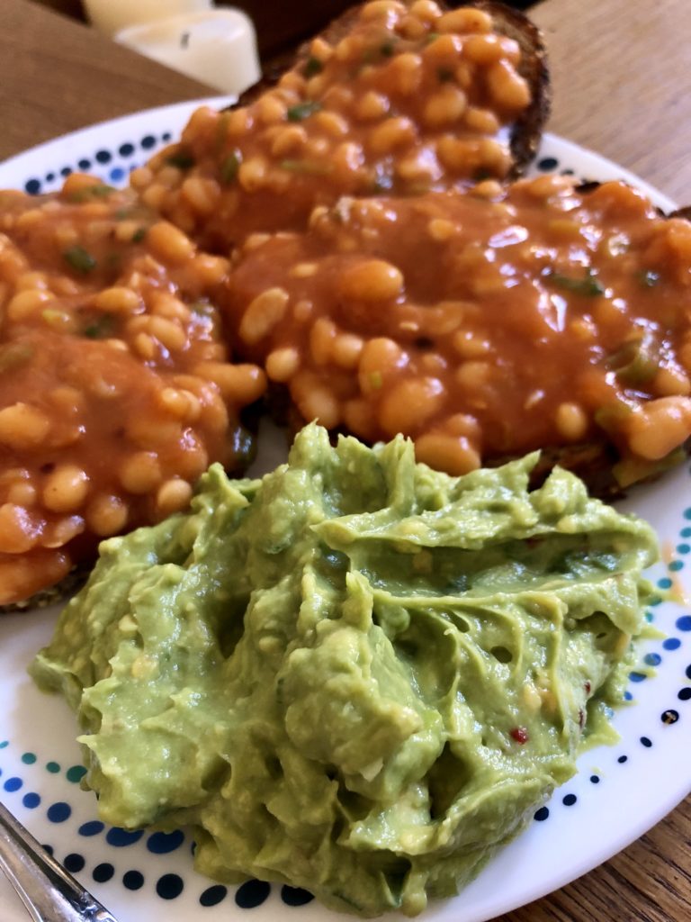 Masala baked beans on toast with smashed avocados