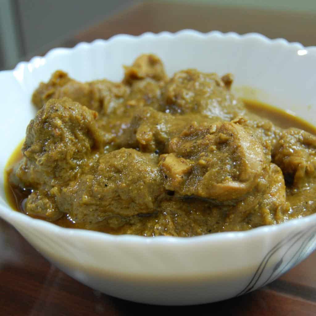 Coriander chicken curry in a white bowl