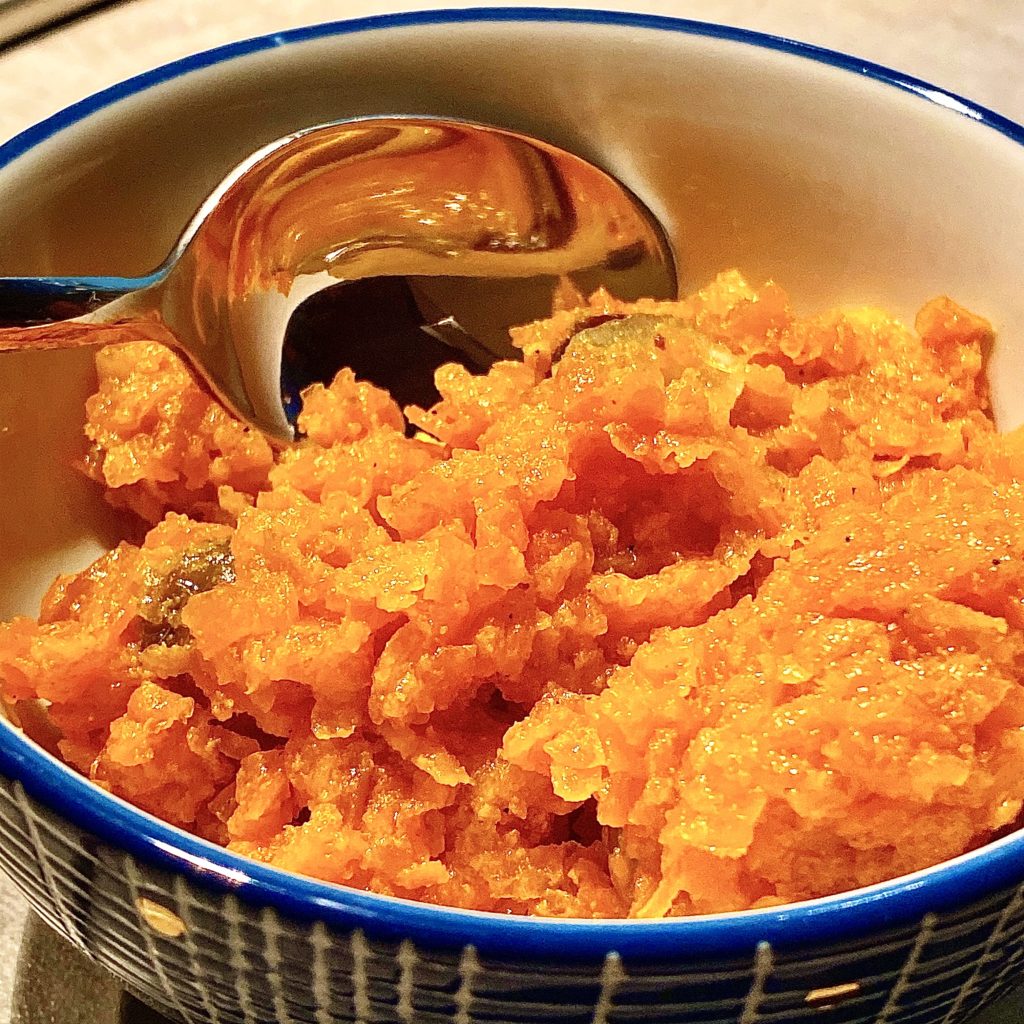 Carrot halwa in a blue and white bowl