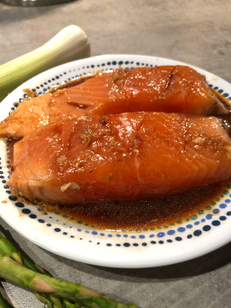 Soy sauce, garlic and honey marinated Itsu styled Salmon with spring onions and asparagus 