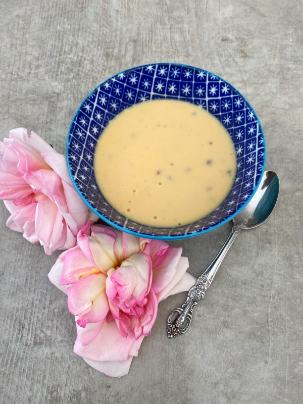 Basundi - thickened evaporated milk with dry fruits and a rose