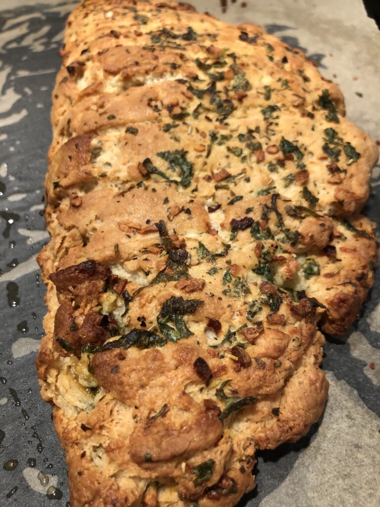 Dominos wholewheat garlic bread with dried red chilli flakes and oregano